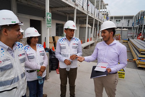 Project workers overseeing construction of a new school