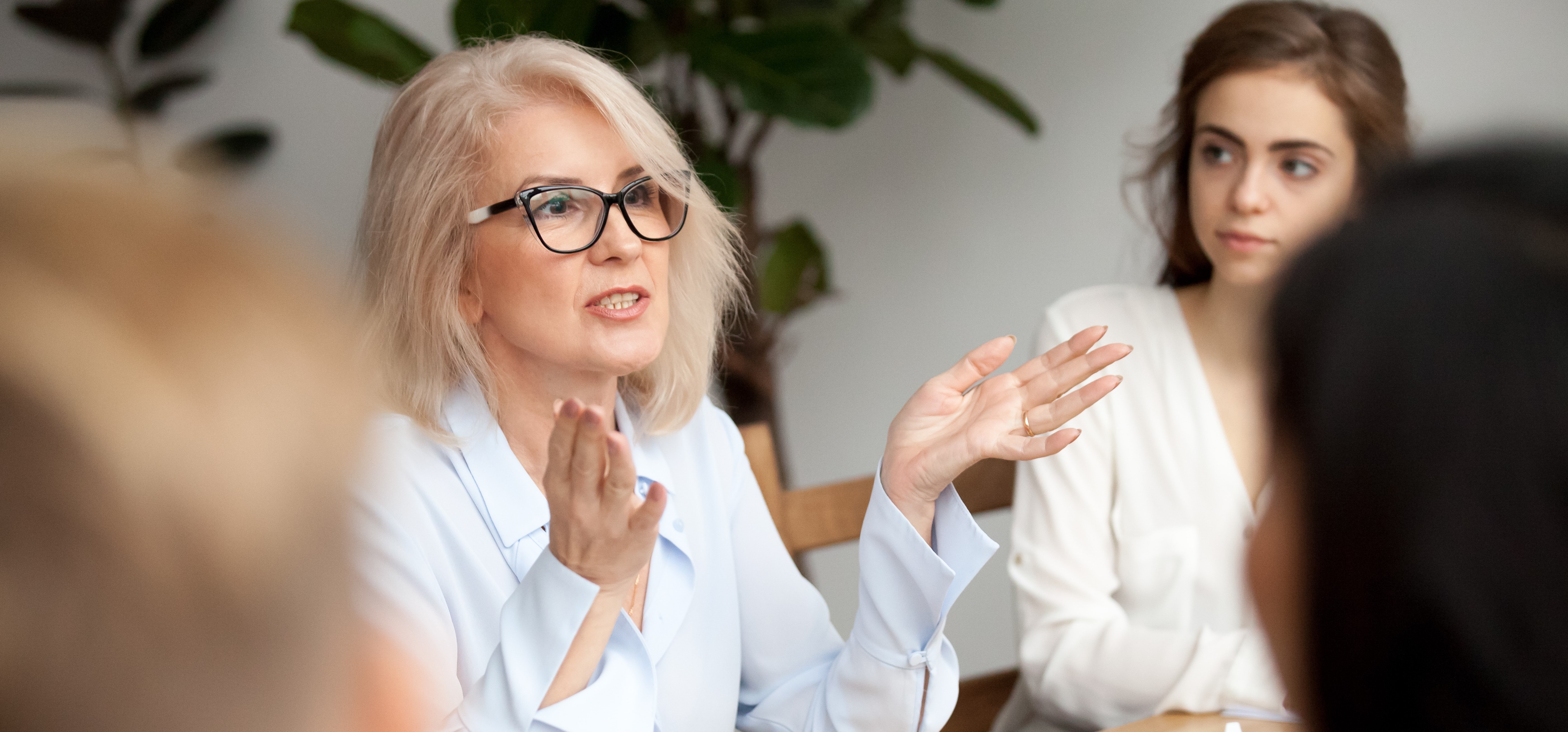 Older Proffessional Explaining To Group