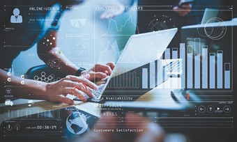 Business professional using a laptop, analysing graphs and charts for strategic decision-making.