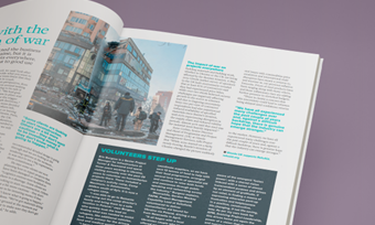 A magazine spread featuring a vibrant photo of diverse individuals engaging on a lively city street.